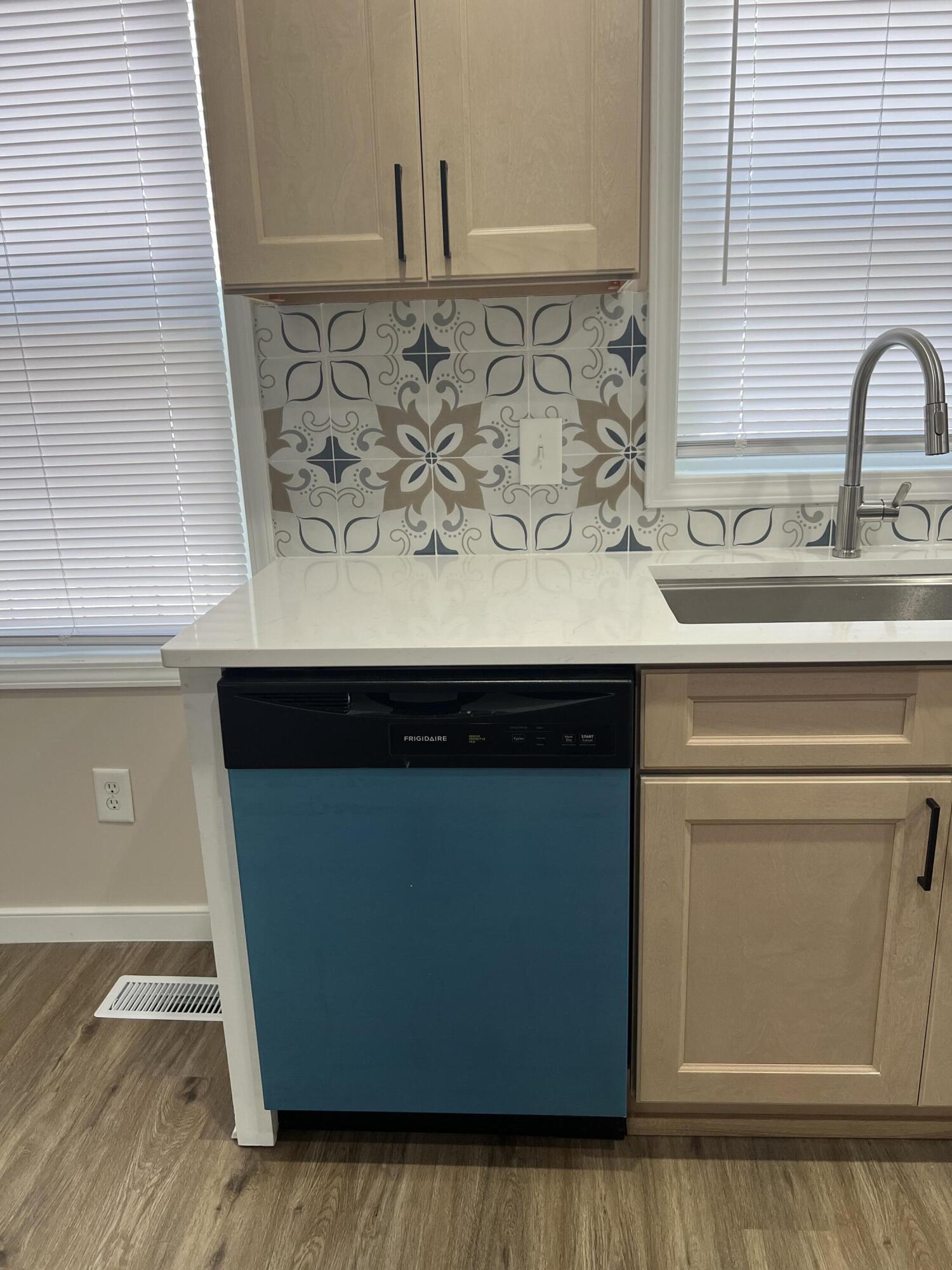 3851 Maple Street Hobart, IN 46342 - Photo 26 of 28 a kitchen with a sink and cabinets
