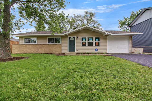 309 Audubon Road Streamwood, IL 60107 - Photo 2 of 25 a front view of a house with a yard