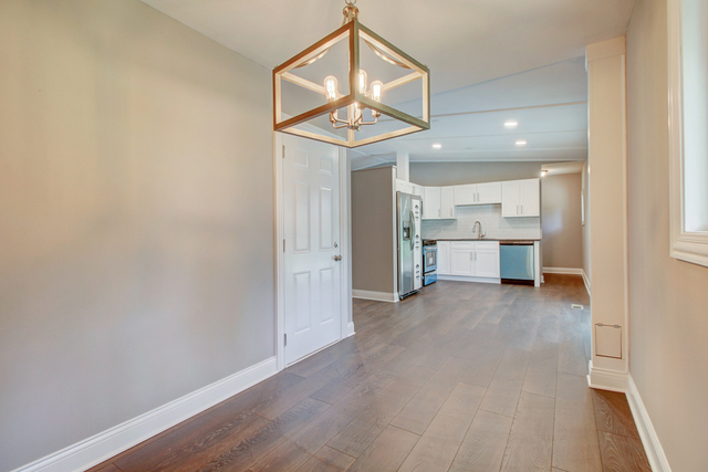 309 Audubon Road Streamwood, IL 60107 - Photo 12 of 25 a view of a kitchen with a sink and a window