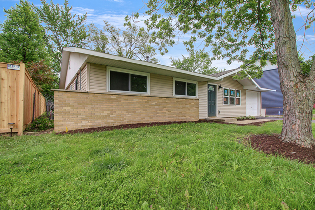 309 Audubon Road Streamwood, IL 60107 - Photo 3 of 25 a view of a house with a yard