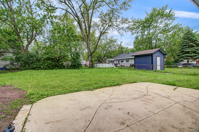 309 Audubon Road Streamwood, IL 60107 - Photo 22 of 25 a view of a house with a yard