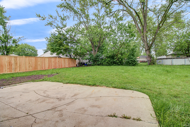 309 Audubon Road Streamwood, IL 60107 - Photo 23 of 25 a view of a backyard with green space