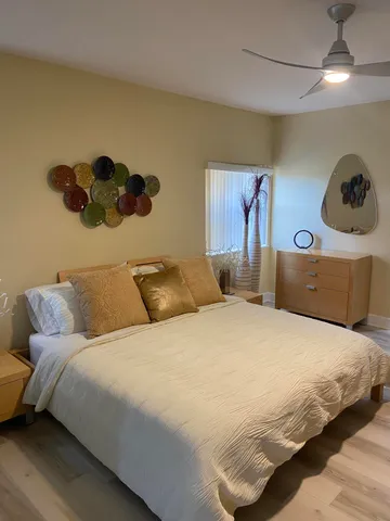 a bedroom with a bed and window