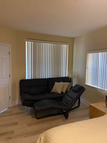a living room with furniture and a window