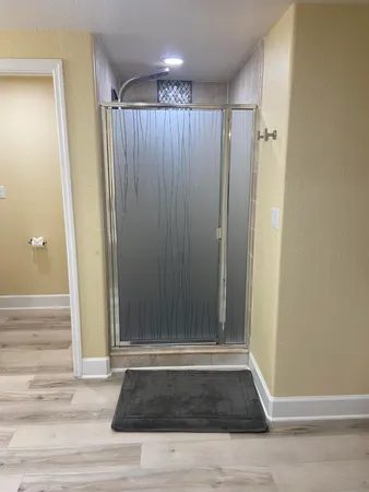 a view of a entryway door with wooden floor