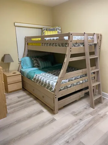 a living room with a bed and furniture