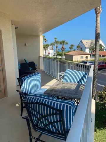 a view of a balcony with wooden floor