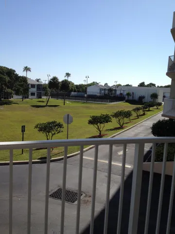 a view of swimming pool with lake and mountain view
