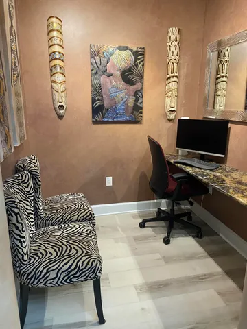 a workspace with furniture and window