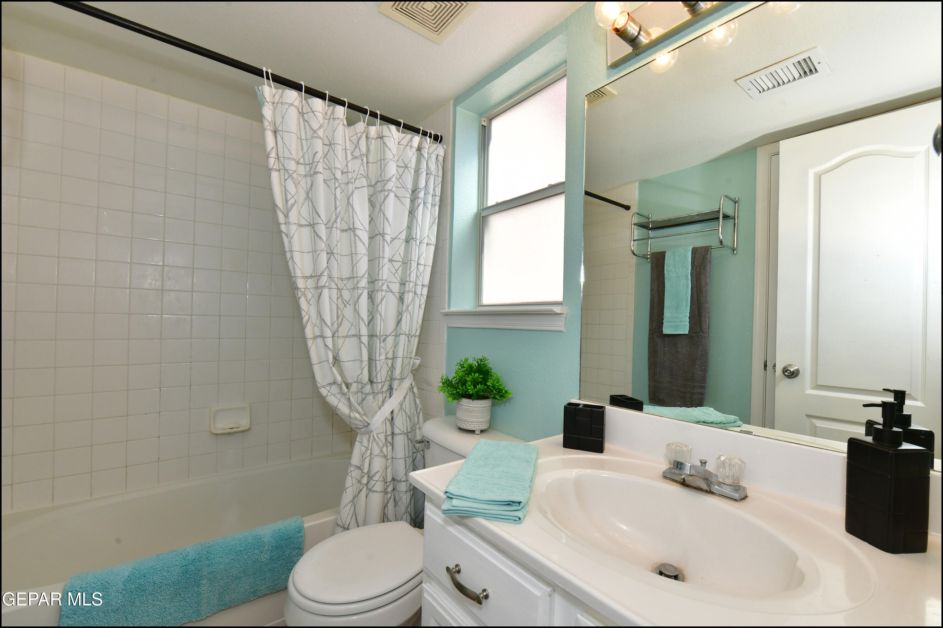 12232 Tierra Rosa Way El Paso, TX 79938 - Photo 17 of 34 a bathroom with a sink a toilet and tub