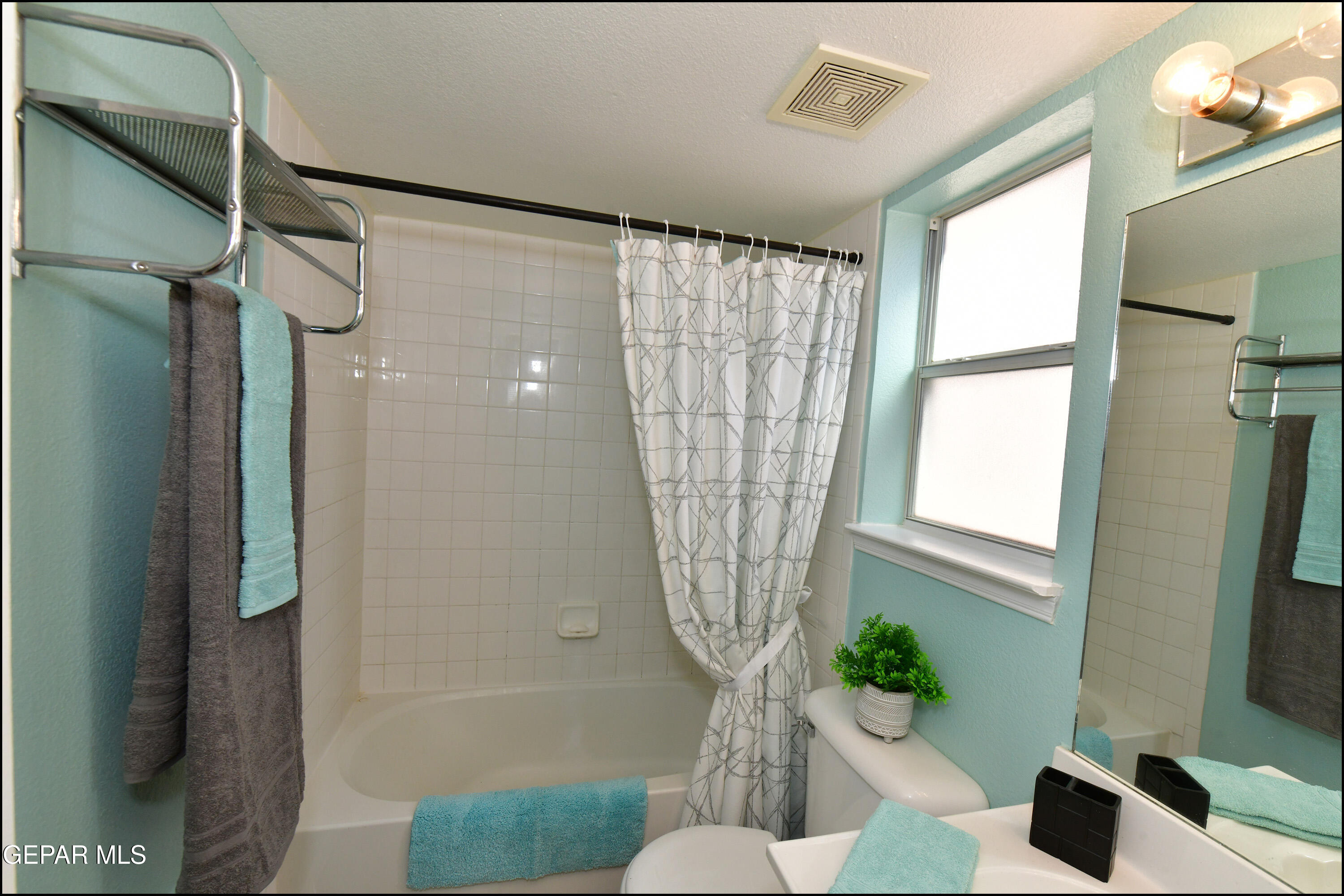 12232 Tierra Rosa Way El Paso, TX 79938 - Photo 18 of 34 a bathroom with a sink toilet and shower