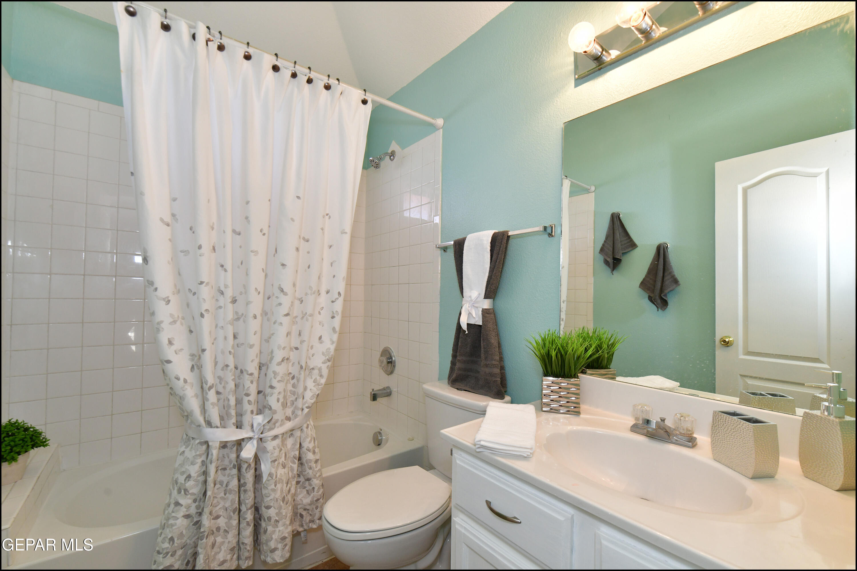 12232 Tierra Rosa Way El Paso, TX 79938 - Photo 20 of 34 a bathroom with a toilet sink and mirror