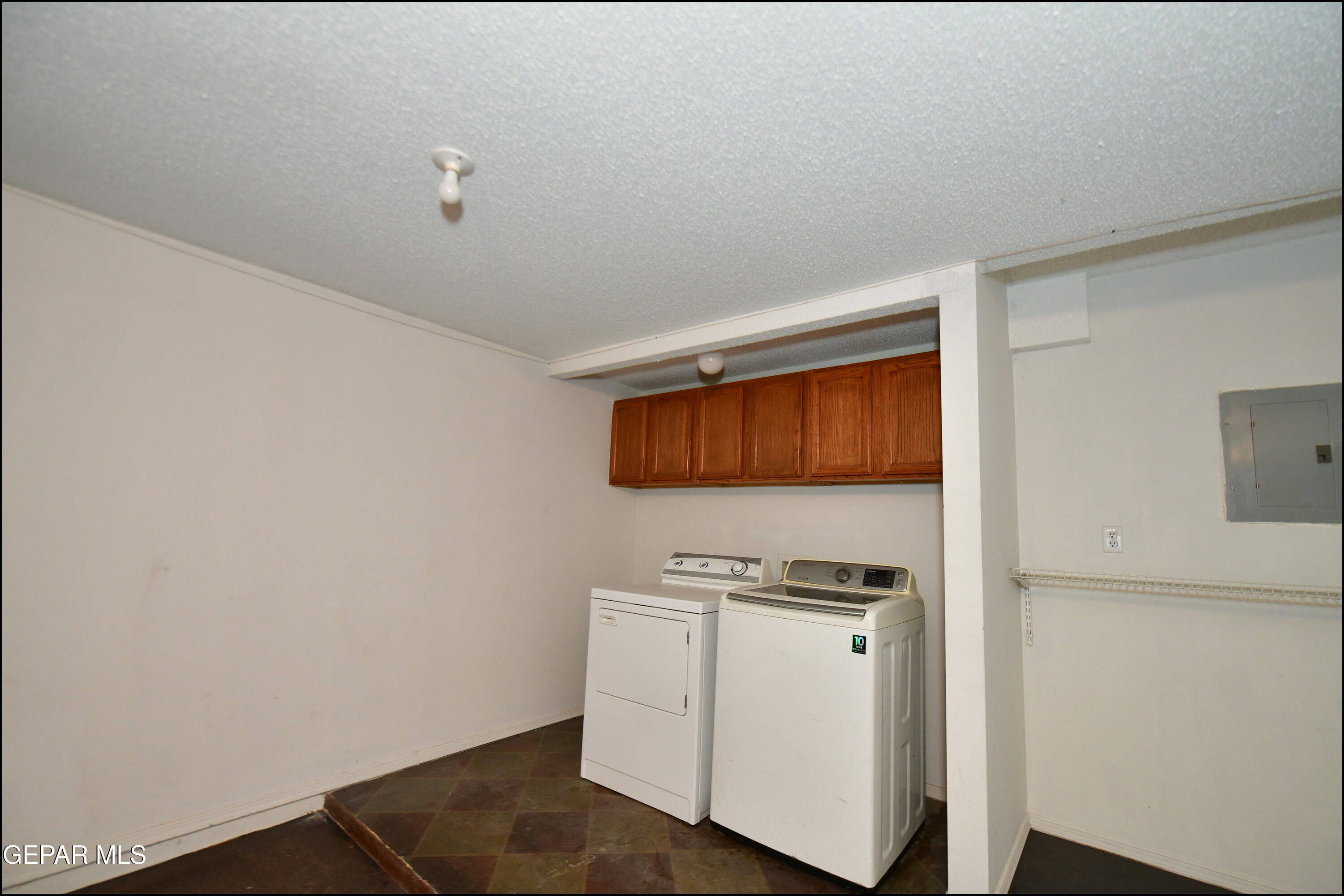 12232 Tierra Rosa Way El Paso, TX 79938 - Photo 23 of 34 a white refrigerator freezer and a stove sitting inside of a kitchen