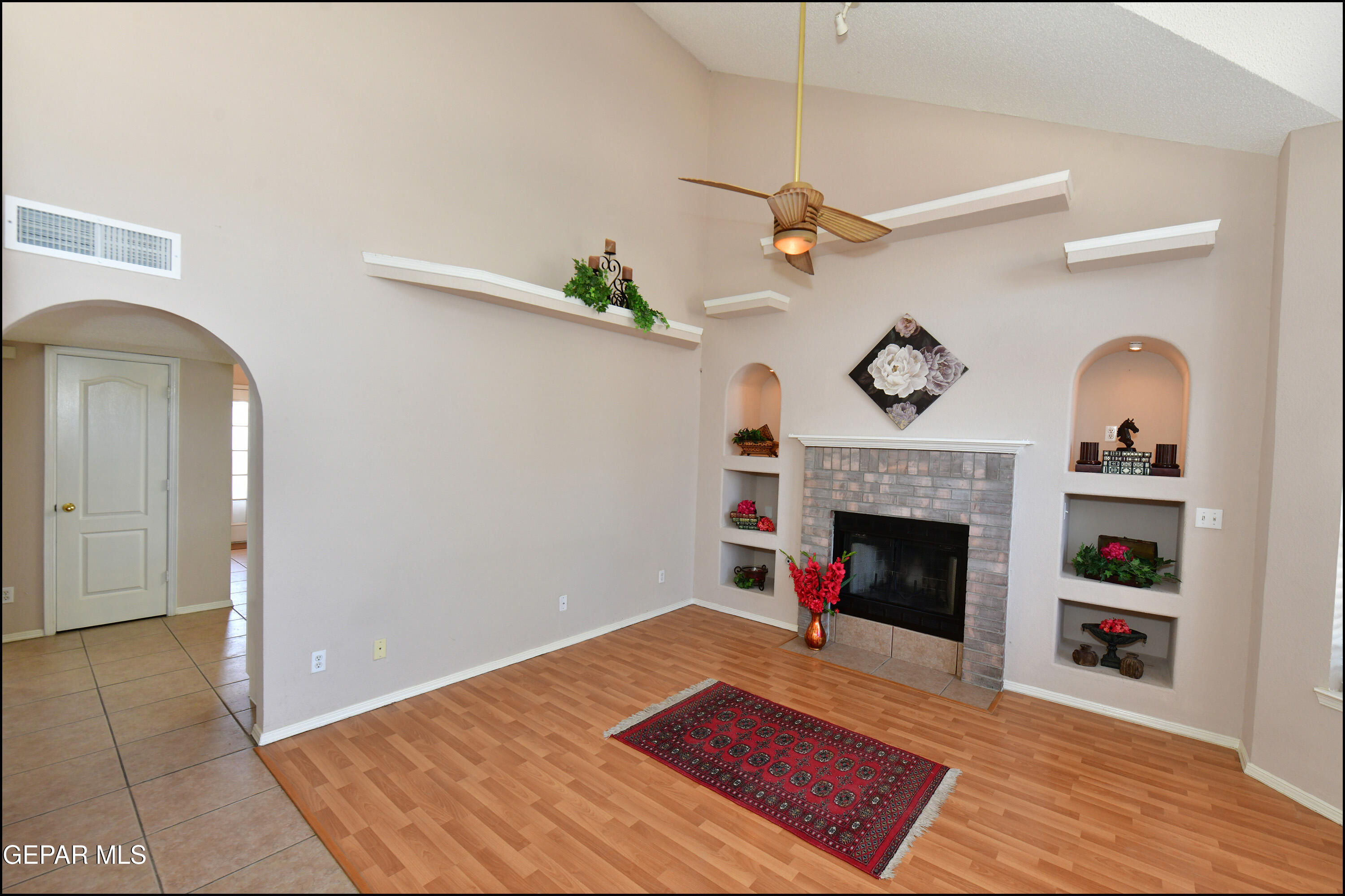 12232 Tierra Rosa Way El Paso, TX 79938 - Photo 3 of 34 a living room with furniture and a fireplace