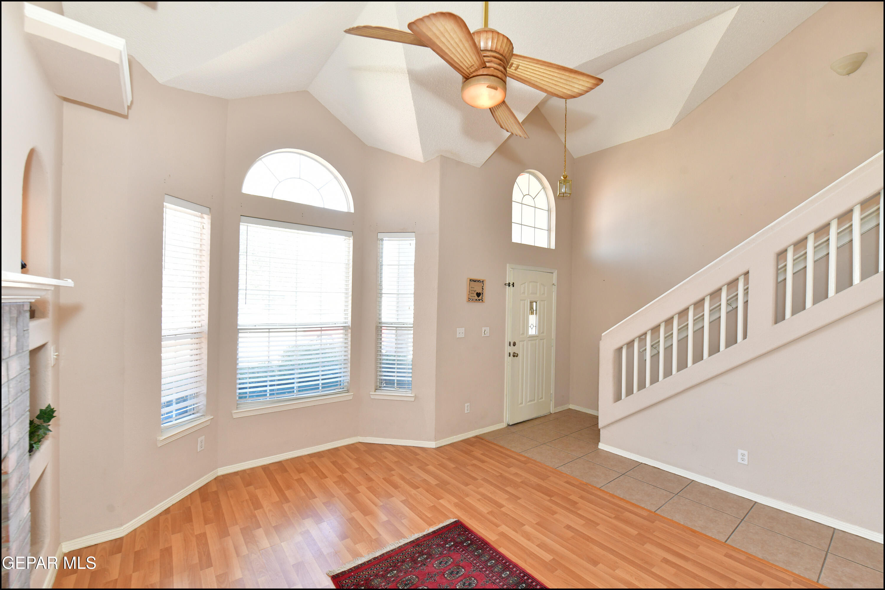 12232 Tierra Rosa Way El Paso, TX 79938 - Photo 5 of 34 a view of an empty room with window and wooden floor