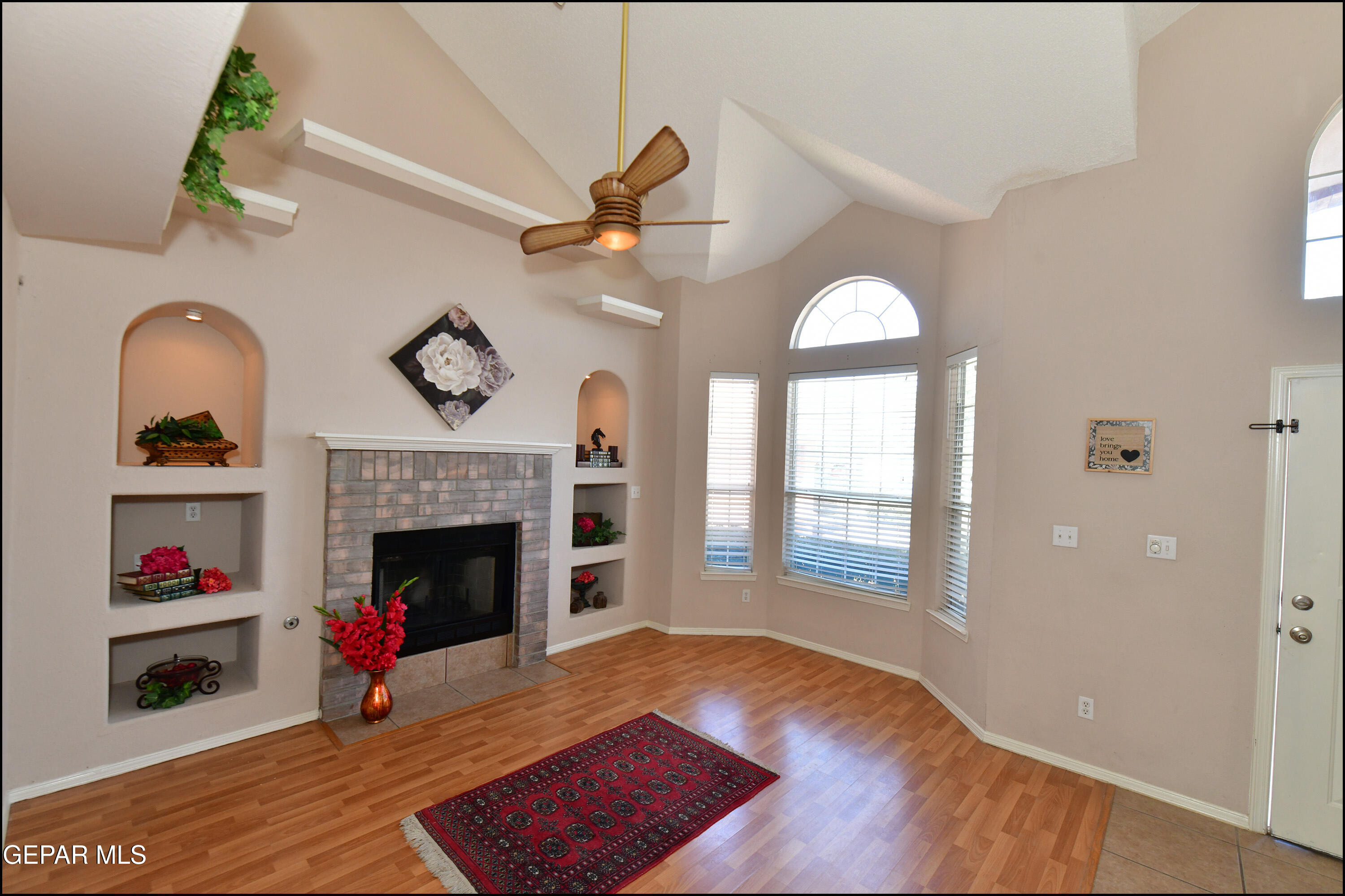 12232 Tierra Rosa Way El Paso, TX 79938 - Photo 6 of 34 a living room with furniture and a fireplace