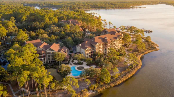 a view of a house with a tree in front