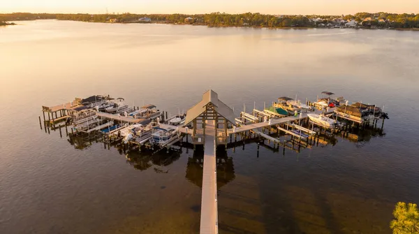 a swimming pool view with a seating space and a garden view