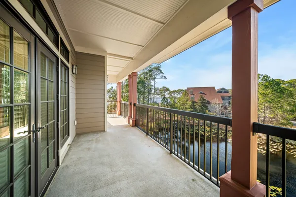a kitchen with stainless steel appliances granite countertop hardwood a sink and a refrigerator