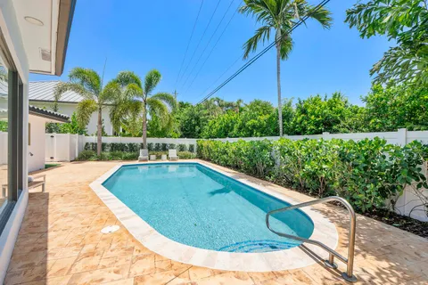 a view of a swimming pool with a garden