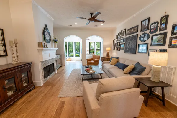 a living room with furniture and a fireplace