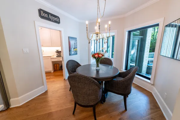 a kitchen with a stove and white cabinets