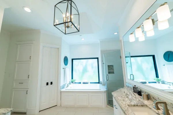 a kitchen with a stove sink and cabinets