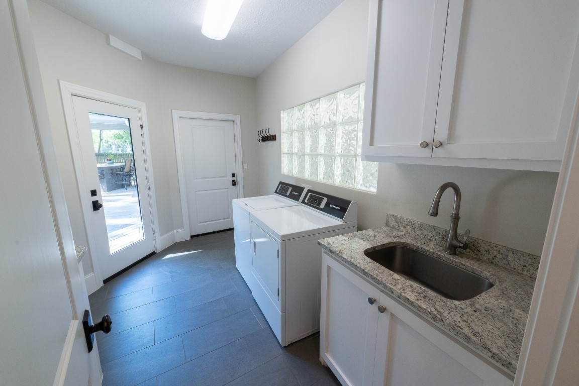 6 Red Sable Point The Woodlands, TX 77380 - Photo 24 of 50 a kitchen with a stove sink and cabinets