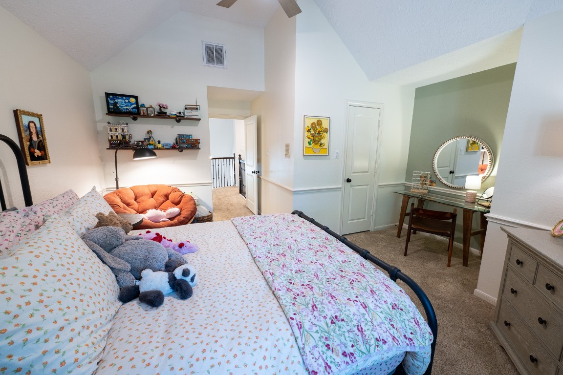 6 Red Sable Point The Woodlands, TX 77380 - Photo 29 of 50 a bedroom with a bed and wooden floor