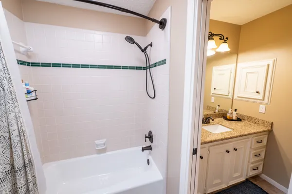 a front view of a house with swimming pool having outdoor seating