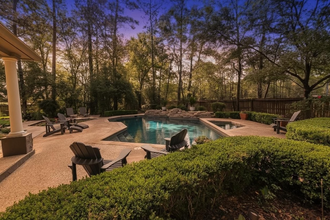 6 Red Sable Point The Woodlands, TX 77380 - Photo 36 of 50 a swimming pool with outdoor seating and trees