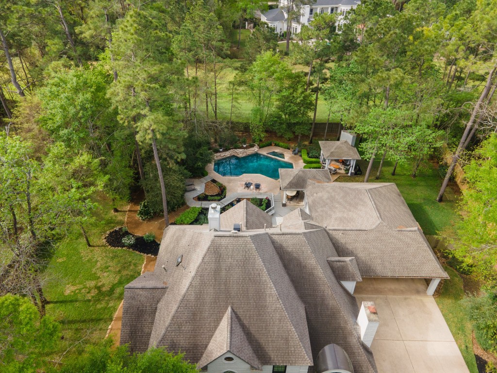 6 Red Sable Point The Woodlands, TX 77380 - Photo 8 of 50 a view of backyard with a garden and entertaining space