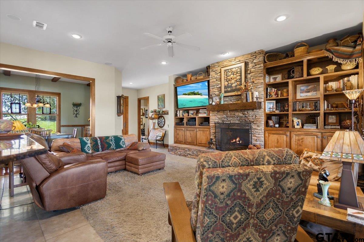 24050 Red Azalea Lindale, TX 75771 - Photo 8 of 48 a living room with fireplace furniture and a flat screen tv