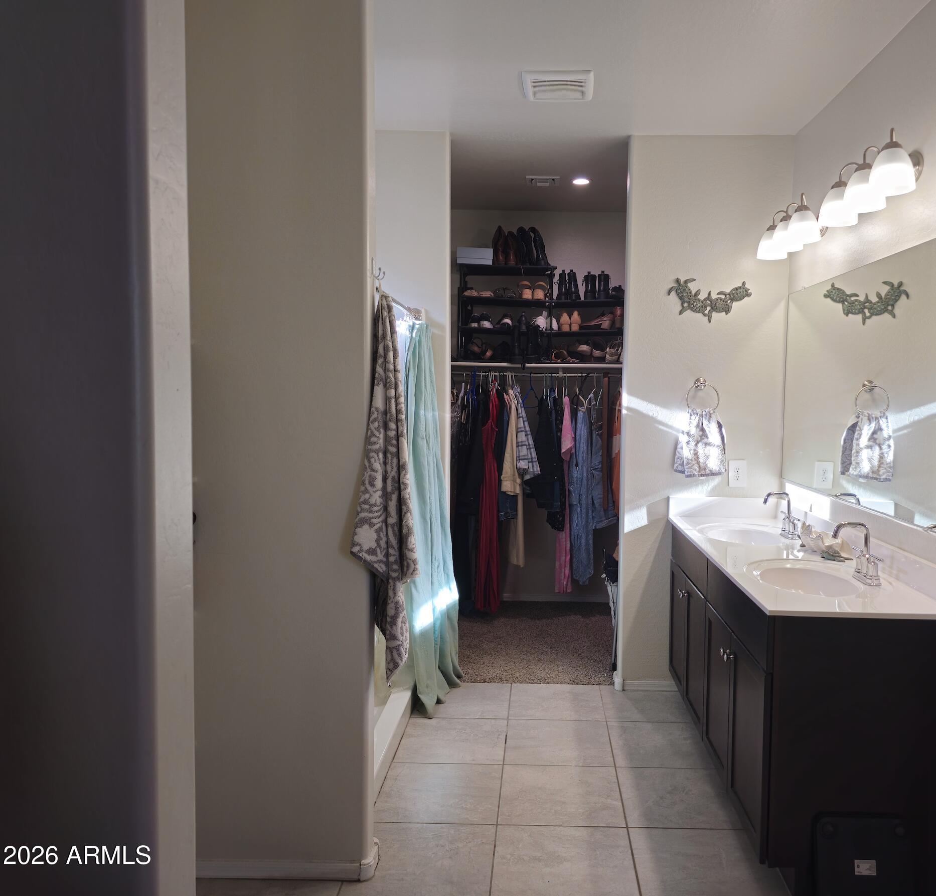9434 Cotton Road Florence, AZ 85132 - Photo 12 of 25 a kitchen with a sink and a refrigerator
