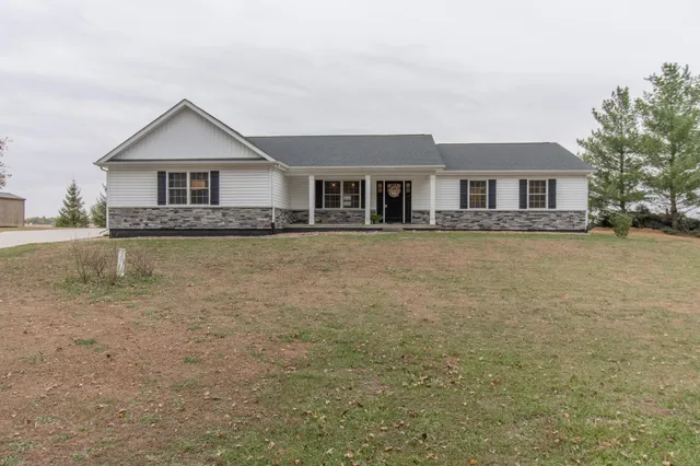 a front view of a house with yard