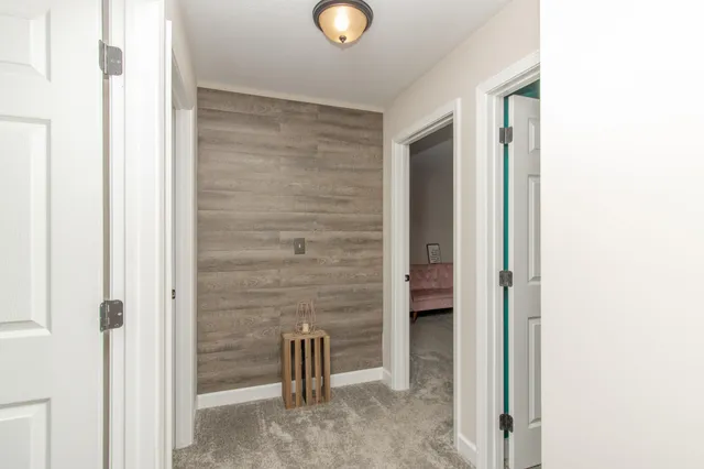 a view of an empty room with wooden door