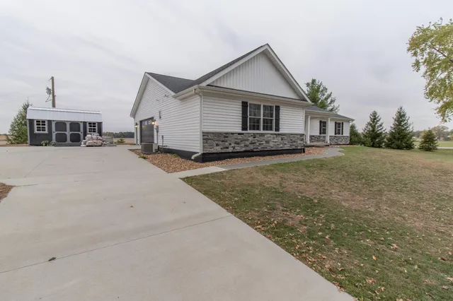 front view of a house with a yard