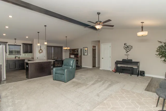 a kitchen with a stove a refrigerator and a fireplace