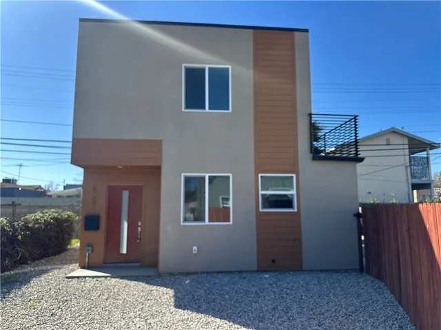 a view of a house with a door and wooden floor