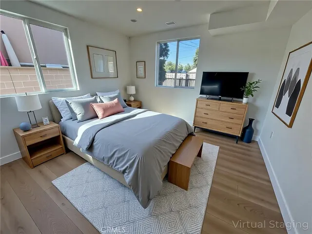 a bedroom with a bed and a couch