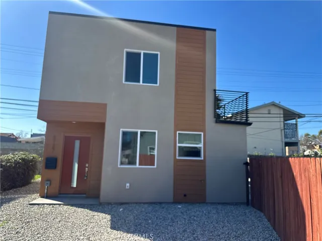 a view of a house with a door and balcony