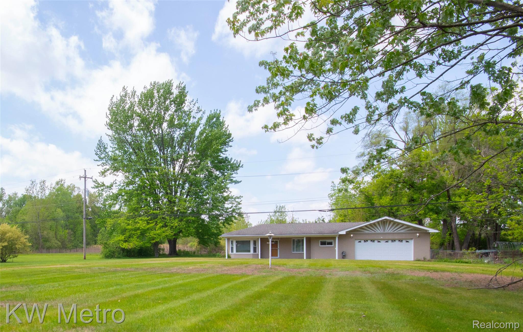 10800 Holland Road Taylor, MI 48180 - Photo 1 of 16 Single story home featuring a garage, a front lawn, and driveway