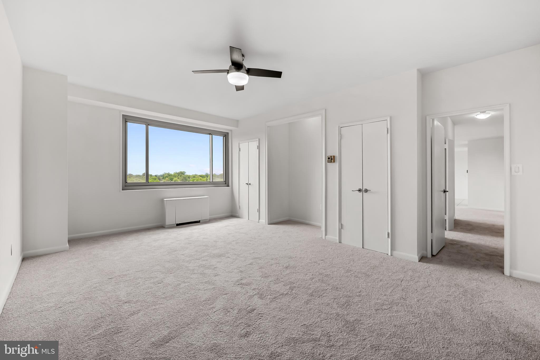 11 Slade Avenue, Unit 911 Baltimore, MD 21208 - Photo 22 of 32 a view of an empty room with a window