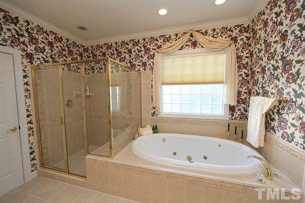 2516 Wertherson Lane Raleigh, NC 27613 - Photo 13 of 25 Jetted soaking tub and oversized shower w/ built in seat.
