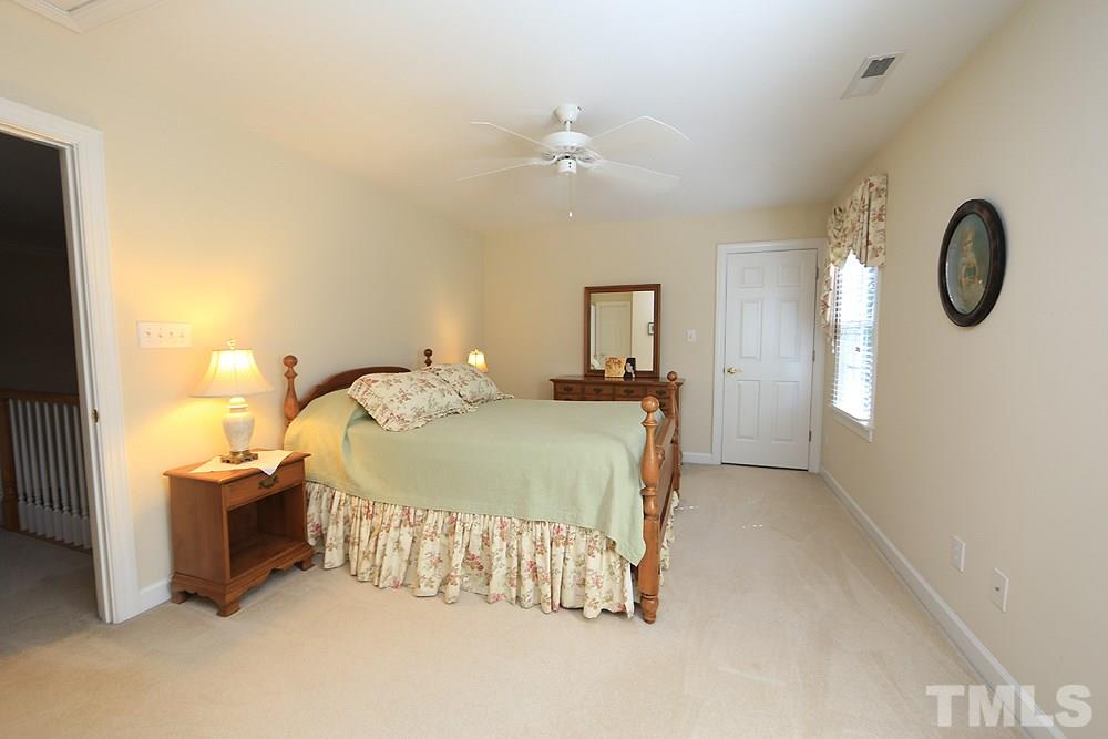 2516 Wertherson Lane Raleigh, NC 27613 - Photo 16 of 25 Second bedroom suite w/ private full bath and large walk in closet.