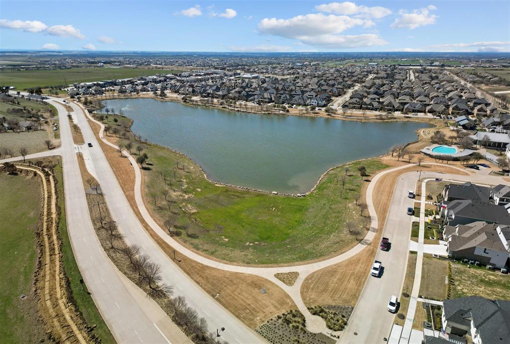 421 Matchbox Street Argyle, TX 76226 - Photo 38 of 40 Aerial perspective showcasing a lake surrounded by residential properties