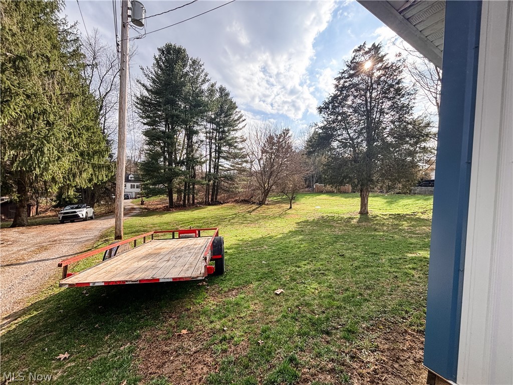 724 East Main Street Barnesville, OH 43713 - Photo 26 of 28 View of green lawn with a wooden deck