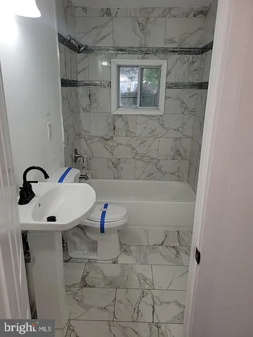 a view of storage and utility room with washer and dryer