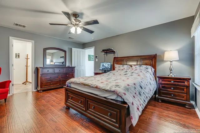 a bedroom with a bed and a dresser