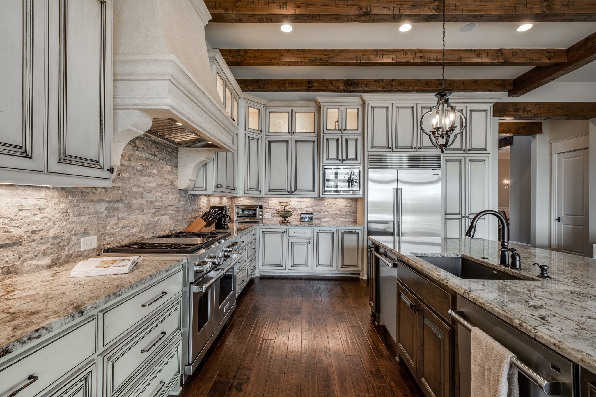 505 Legends Ridge Court Franklin, TN 37069 - Photo 15 of 70 a kitchen with stainless steel appliances granite countertop a sink a stove and cabinets